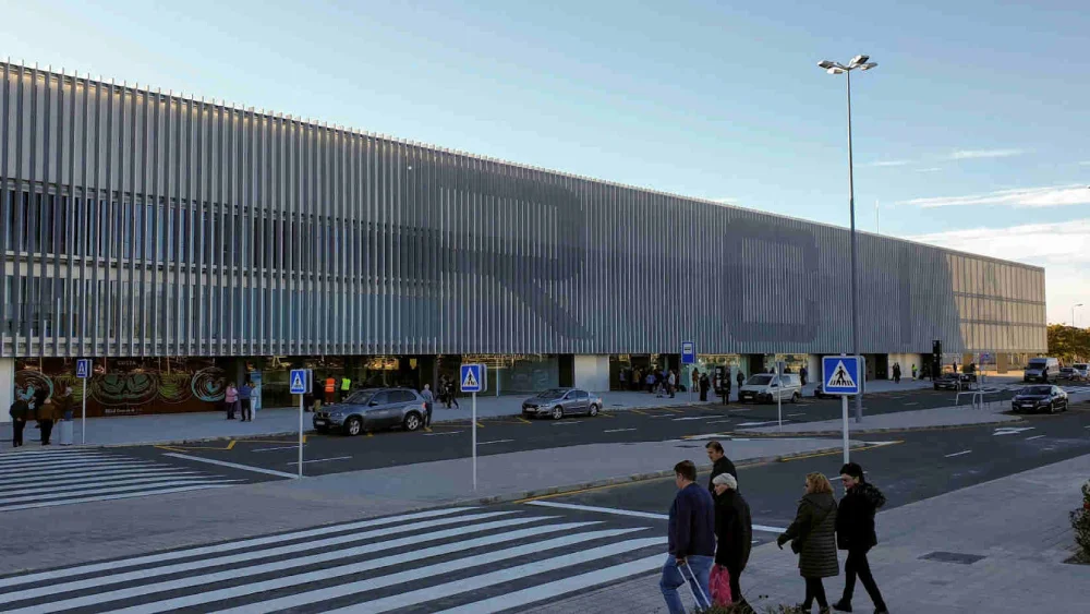 Corvera International Airport terminal building with aircraft on the apron